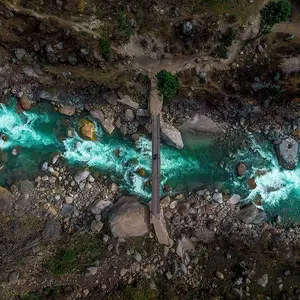 Trekking trails and camping sites with mountain views in Kheerganga, promoting adventure hikes.