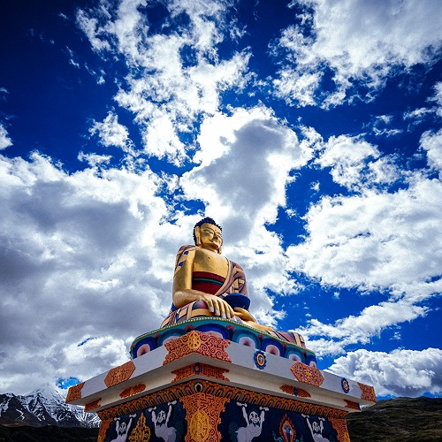 Rugged mountain terrain and ancient monasteries in Spiti Valley, promoting road trips and bike expeditions.
